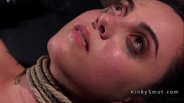 Hogtied and suspended brunette spanked